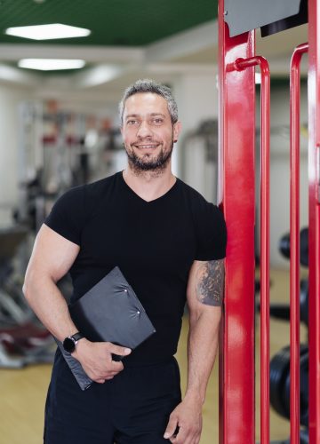 daily-sport-routine-healthy-lifestyle-gray-haired-smiling-coach-man-portrait-in-the-gym.jpg daily-sport-routine-healthy-lifestyle-gray-haired-smiling-coach-man-portrait-in-the-gym.jpg